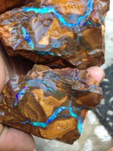Further cutting to reveal bright seams of opal
